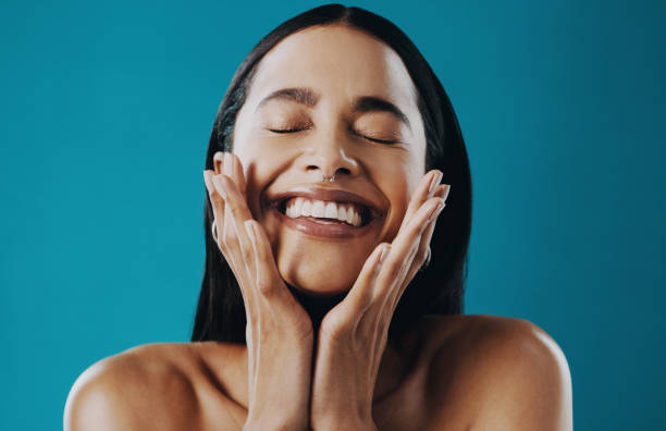 Cropped shot of a beautiful young woman posing against a blue background