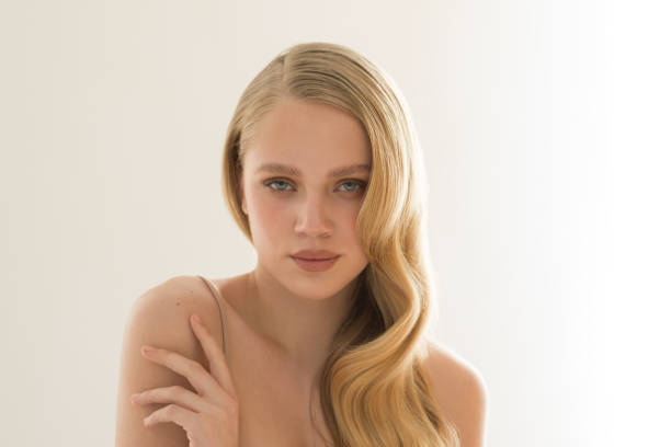 Close up studio shot of a beautiful natural blonde woman.