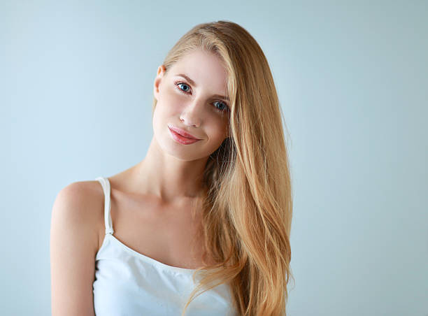 Portrait of beautiful woman isolated on gray background