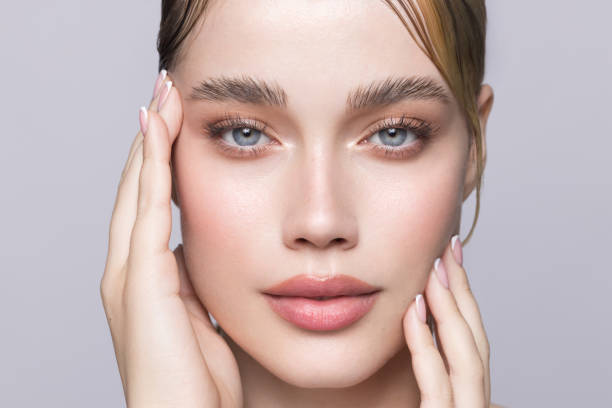 Close up studio shot of a beautiful blonde woman. Studio shot.