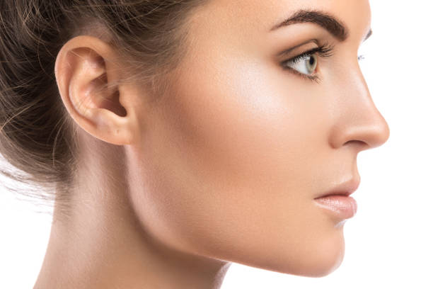Female face in profile on white background