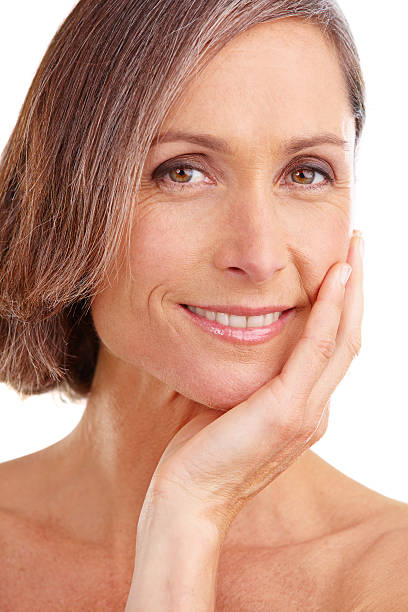 Studio portrait of a beautiful mature woman posing against a white background
