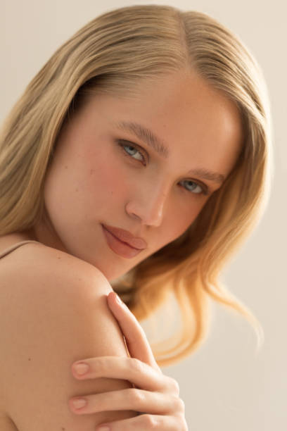 Close up studio shot of a beautiful natural blonde woman.