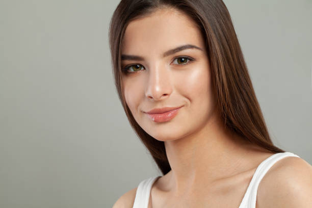 Beautiful brunette woman face close up portrait