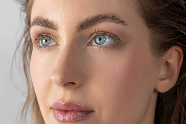 Young woman with perfect clean healthy glowing skin and make-up look