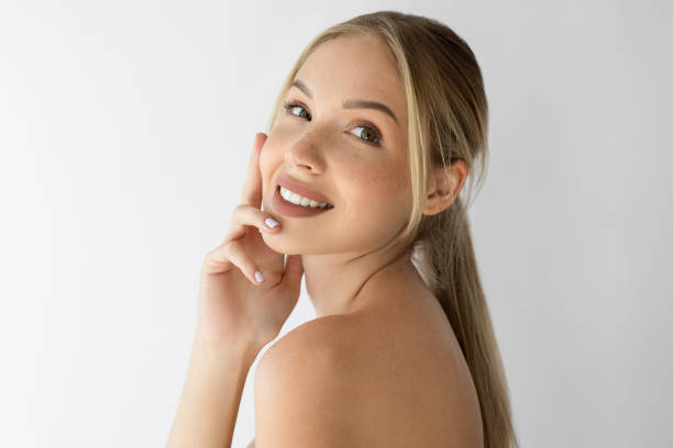 Beautiful woman smiling and looking away with positive emotion